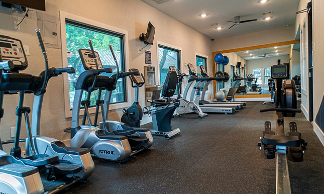A recreational room with different fitness equipment